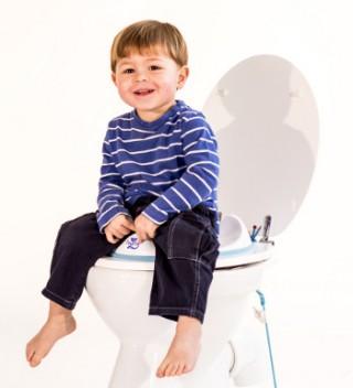 boy on toilet training seat